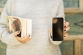 Girl with blank cell phone and books Royalty Free Stock Photo