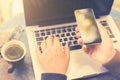 Girl with blank cell phone, laptop and cup of coffee Royalty Free Stock Photo