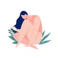 A girl bleeding hugging her leg with a pad in the menstrual period on background of leaves and plants. Eco protection