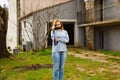 Girl blogger with camera walks in yard of a village house in Provence Royalty Free Stock Photo