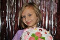 girl with blond hair with a bouquet of marshmallow flowers