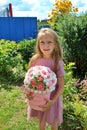 girl with blond hair with a bouquet of marshmallow flowers