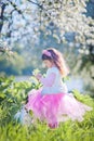 Girl in blossom park Royalty Free Stock Photo