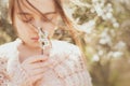 Girl and the blossoming bush at spring