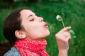 Girl blow on Dandelion