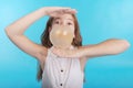 Girl blowing a big bubble gum bubble Royalty Free Stock Photo