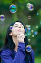 Girl blowing bubbles Royalty Free Stock Photo