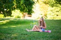 Girl blowing bubbles in park Royalty Free Stock Photo