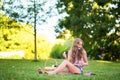 Girl blowing bubbles in park Royalty Free Stock Photo