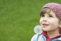 Girl blowing dandelion Royalty Free Stock Photo