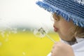 Girl blowing dandelion Royalty Free Stock Photo