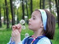 Girl Blowing on Dandelion Royalty Free Stock Photo