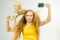 Girl blowing hair with comb brush Royalty Free Stock Photo