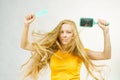 Girl blowing hair with comb brush Royalty Free Stock Photo