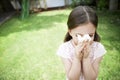 Girl Blowing Nose In Backyard Royalty Free Stock Photo