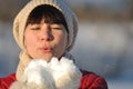 Girl Blowing Snow
