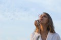 Girl blowing soap bubbles Royalty Free Stock Photo