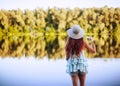 The girl blowing soap bubbles. Happy child  plays outdoors in nature Royalty Free Stock Photo