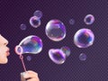 Girl blowing soap bubbles. Woman blow realistic flying bubble blower wand with spectrum rainbow reflection, child game Royalty Free Stock Photo