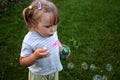 Girl blowing the soap bubles Royalty Free Stock Photo