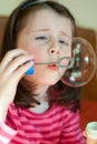 Girl blows bubbles