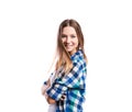 Girl in blue checked shirt, arms crossed, isolated