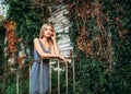 Woman in blue dress against the abandoned house Royalty Free Stock Photo