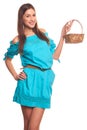 Girl in blue dress with basket isolate on hite background