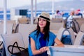 Girl in blue dress and hat have a voyage on a boat Royalty Free Stock Photo