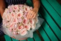 Girl holding bouquet of pastel color rose peonies Royalty Free Stock Photo