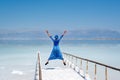 Girl in a blue dress on the shores of the dead sea in Israel on a sunny day Royalty Free Stock Photo