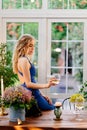 Girl in blue dress standing with glass of wine Royalty Free Stock Photo