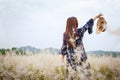 Girl in a blue dress on a wheat field. woman in meadow concept Royalty Free Stock Photo