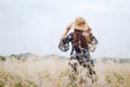 Girl in a blue dress on a wheat field. woman in meadow concept