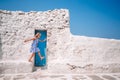 Girl in blue dresses having fun outdoors on Mykonos streets Royalty Free Stock Photo