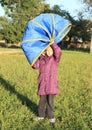 Girl with blue kids tunnel Royalty Free Stock Photo