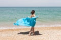 Girl in blue pareo on beach