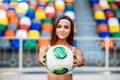 Girl in blue shorts workout on stadium