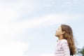 Girl with blue sky. Royalty Free Stock Photo