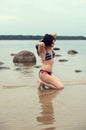 Girl in blue swimmsuit in the sea Royalty Free Stock Photo