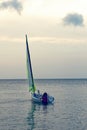 Girl boarding Laser sailboat Royalty Free Stock Photo