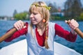 Girl in a boat rowing