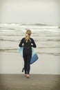 Girl with body board on Rockaway beach Oregon Royalty Free Stock Photo