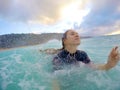 Girl bodysurfing in hawaii Royalty Free Stock Photo