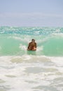 Girl boogie boarding the waves Royalty Free Stock Photo