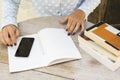 Girl with books, cell phone and diary Royalty Free Stock Photo