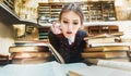 Girl with Books in the Library Royalty Free Stock Photo