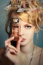 Girl with a bottle of perfume about her face Royalty Free Stock Photo