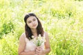 Girl with bouquet of daisies on summer meadow Royalty Free Stock Photo