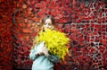 girl with a bouquet of yellow flowers of mimosa in her hands Royalty Free Stock Photo